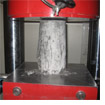 Testing compression strength of a standard concrete test specimen